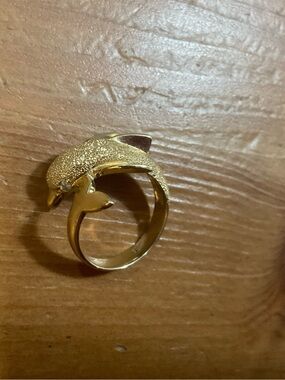 Beverly Hills Gold: 14k. Wrap around dolphin ring with diamond eyes size six (6)